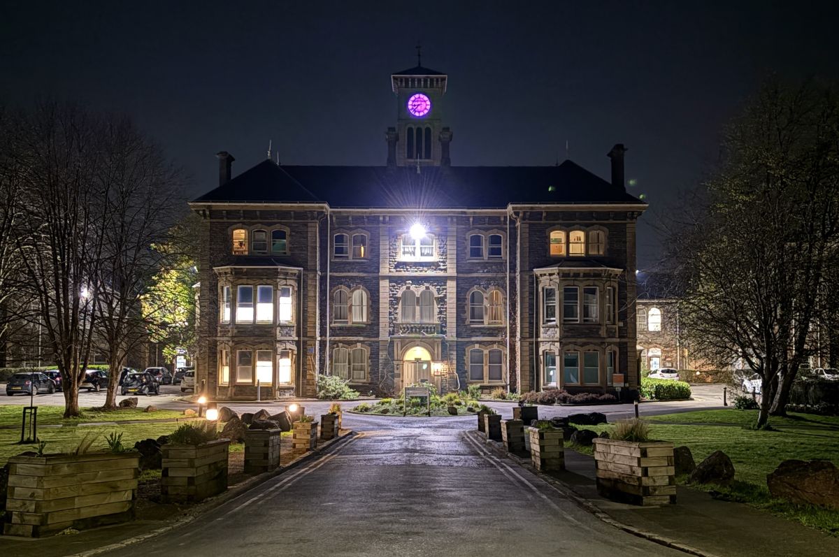 Photo of Glenside Campus main building and clocktower at night