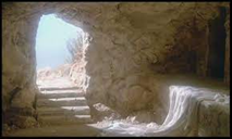 The picture is of a cave entrance with stairs. The sun is shinning through. This represents where Jesus was buried for 3 days before the resurrection.