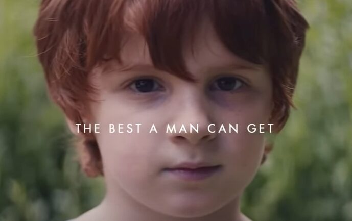 A still shot from the Gillette’s ‘The Best Men Can Be’ advert. a close up of a young boy looking straight into the camera with the text: the best a Man can Get centrally overlayed on the image