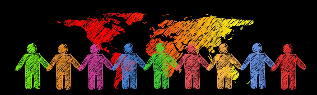 Silhouettes of people in front of a world map