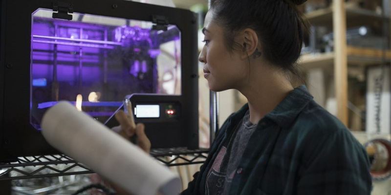 A woman looks at a screen