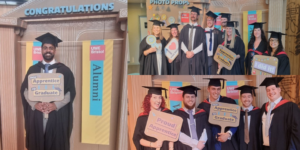 Groups of apprentice graduates dressed in graduation gowns smiling and holding props that say thing such as 'From apprentice to graduate' and 'I love UWE Bristol' in front of a photo wall.